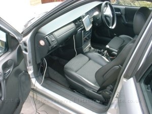 Fitting The Cables3.jpg - Most of the excess cabling went behind the glove box to and backwards down the side of the car and into the boot